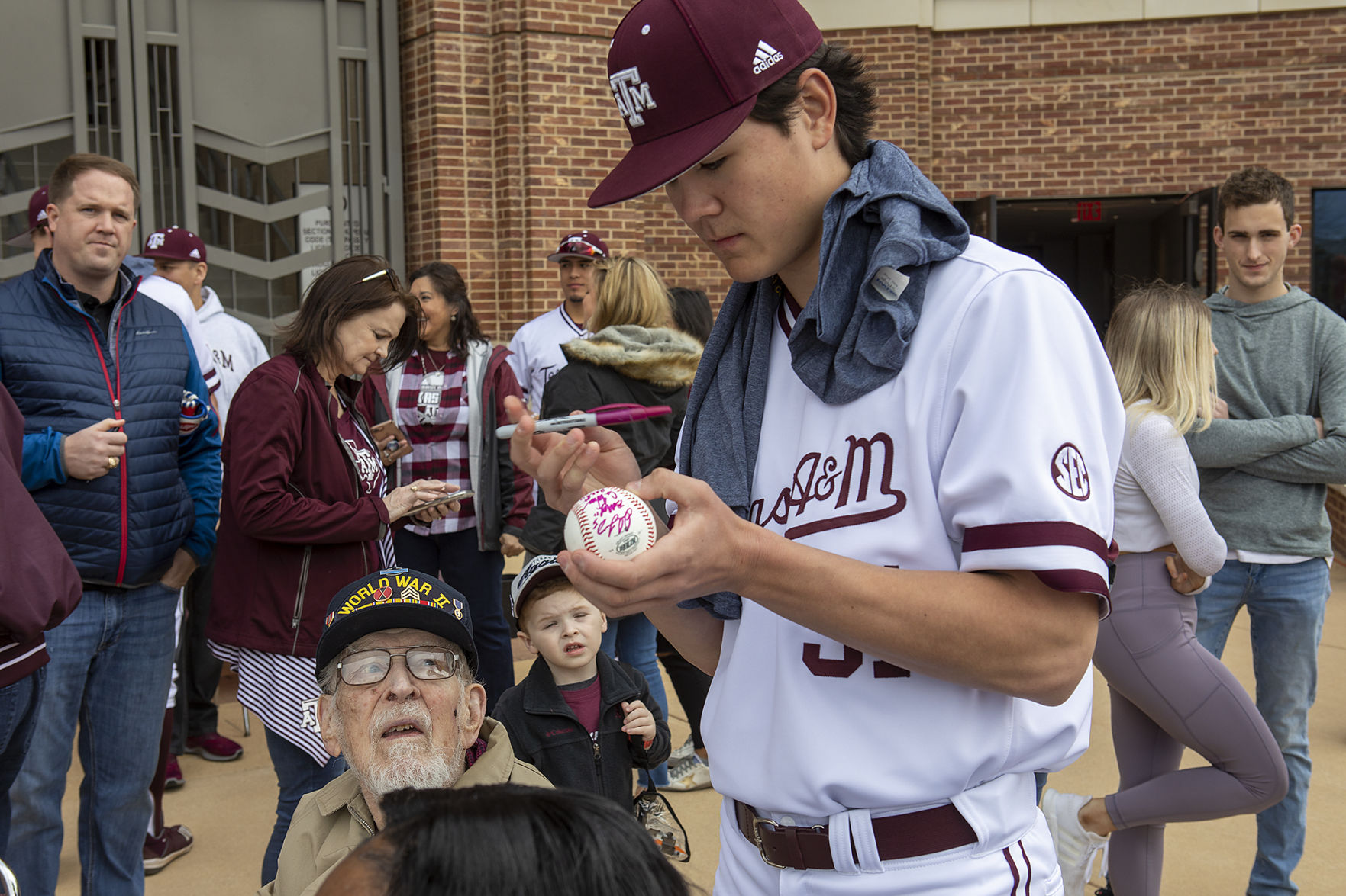 A&M baseball head shaving for cancer